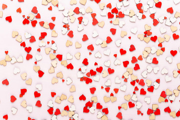 Happy Valentines day background. With small color hearts on gray background.