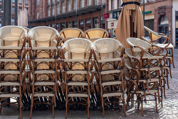 Rows of traditional Chairs of a Street Cafe in France, french furniture in a Street 