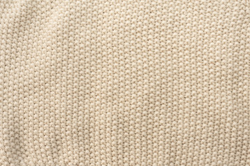 Beige crocheted fabric texture