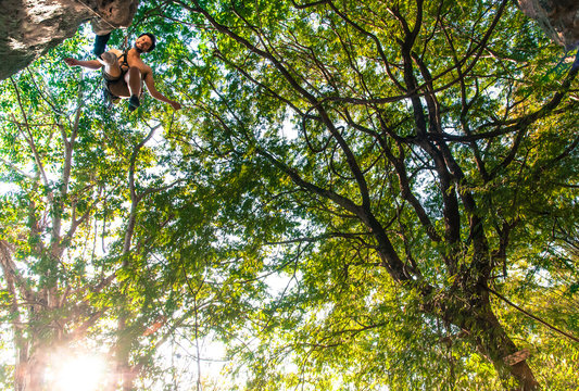 Man Rock Climbing In Crazy Horse Buttress Next To Chiang Mai, Thailand