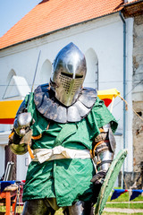 The man is in the costume of a medieval knight. Medieval knight is ready for battle_