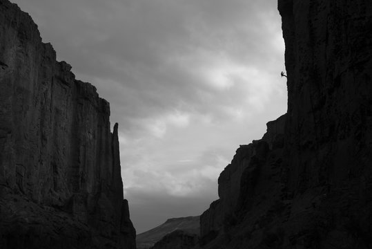 Rock climber on wall of La Buitrera Canyon in the arear of Piedra Parada, Chubut Province, Patagonia, Argentina
