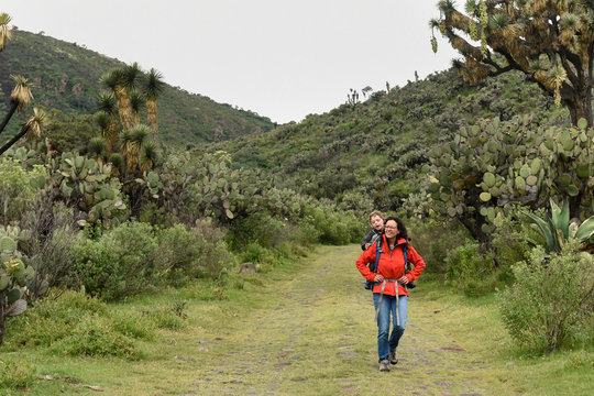 Mother and son hiking in natural setting, Tepeapulco, Hidalgo, Mexico