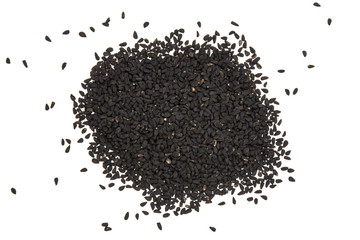 Lot of whole black cumin seeds flatlay isolated on white background