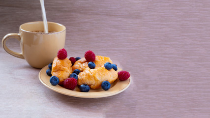 fresh juicy summer berries raspberry and blueberry with drops of honey in a natural beige cotton cloth. 