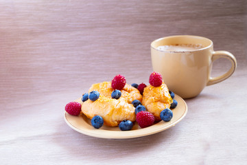 fresh juicy summer berries raspberry and blueberry with drops of honey in a natural beige cotton cloth. 