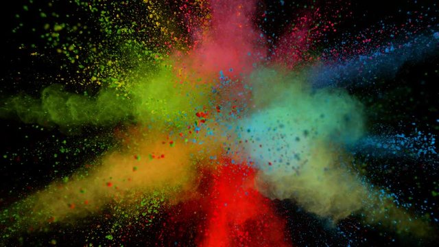Super slowmotion shot of color powder explosion isolated on black background.
