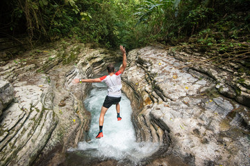 Jumping into a river in?Los?Limones,?Xicotepec, Puebla State, Mexico