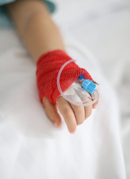 Details with a cannula on the hand of a ill little girl