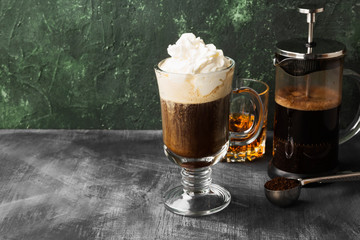 Irish coffee with whisky on dark background. Copy space. Food background