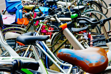 Group of bicycles parking. Sport concept with bicycle. Pile of bikes in the street of netherlands city Amsterdam. Selective focus