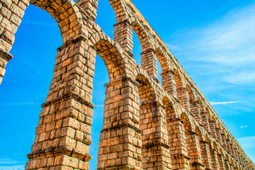 Fototapeta na wymiar Ancient Roman aqueduct on Plaza del Azoguejo in Segovia, Spain.
