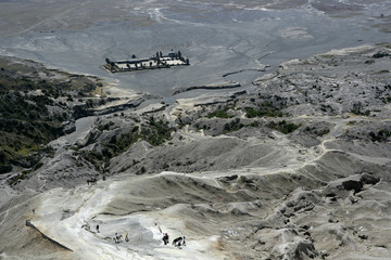 Indonesia, Java, East Java Province, Bromo Tengger Semeru National Park, horsemen bring tourist on top of Gunung Bromo Crater
