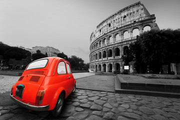 Old car in the background of the Colosseum in Rome - obrazy, fototapety, plakaty