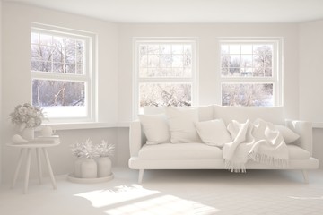 Fototapeta na wymiar White stylish minimalist room in grey color with sofa and winter landscape in window. Scandinavian interior design. 3D illustration