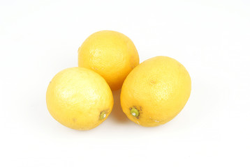 three organic lemons on white background