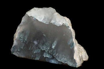 Macro stone mineral smoky quartz on a black background