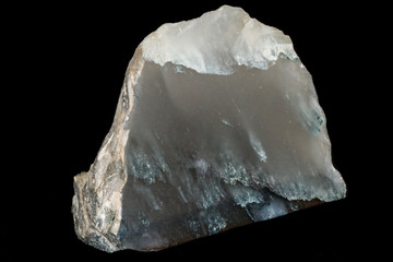 Macro stone mineral smoky quartz on a black background