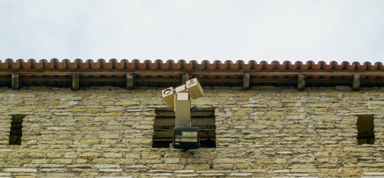 10827_A_security_camera_on_the_window_of_the_castle.jpg