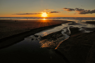 Higher low tides and beach erosion