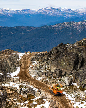 Rock crawler machine carrying wood at Whistler Mountain