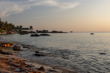 Fototapeta na wymiar Rocky part of Long Beach on Phu Quoc Island in evening sun