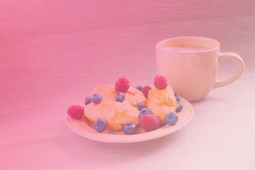 fresh juicy summer berries raspberry and blueberry with drops of honey in a natural beige cotton cloth. 