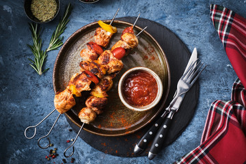 Chicken Shish kebab with mushrooms, cherry tomato and sweet pepper, Grilled meat skewers.