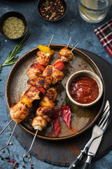 Chicken Shish kebab with mushrooms, cherry tomato and sweet pepper, Grilled meat skewers.