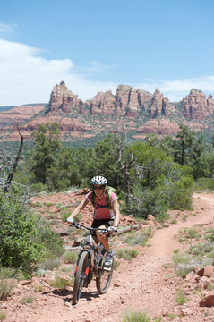 Woman rides the Submarine Rock Loop in South Sedona, Arizona