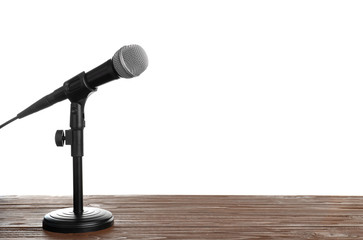 Modern microphone on table against white background. Space for text