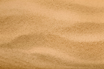 Dry sand on beach as background, closeup
