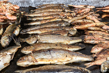 Mackerel fish prepared on hot hood a street food festival, cooked and ready to eat