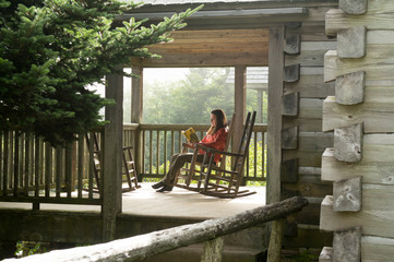 A woman reading at the Leconte Lodge, Great Smoky Mountain National Park, Gatlinburg, Tennesee.