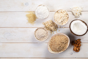 Gluten free concept - selection of alternative flours and ingredients, copy space