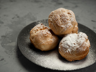 Delicious tender profiteroles with cream