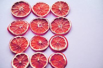Dried oranges on colorful background.