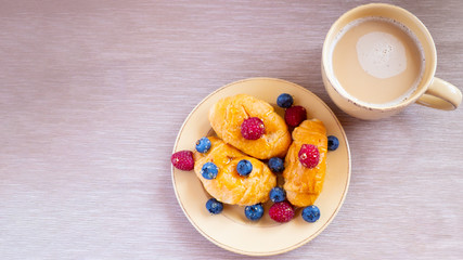 fresh juicy summer berries raspberry and blueberry with drops of honey in a natural beige cotton cloth. 