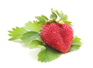 Ripe strawberry with leaves.