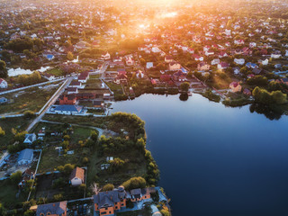 aerial view of rural village on sunset. drone shot. Scenic sunlight landscape. Beautiful coast