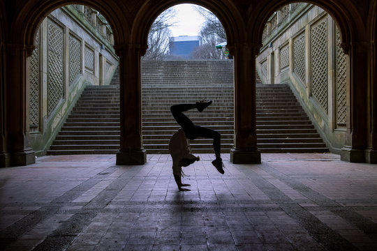 a woman doing yoga in central parck