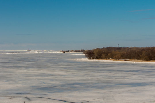 Tolbukhin lighthouse in the Gulf of Finland and Fort Reef. Ice hummocks.
