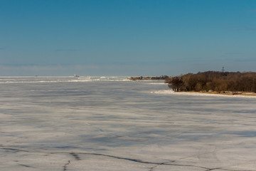 Tolbukhin lighthouse in the Gulf of Finland and Fort Reef. Ice hummocks.
