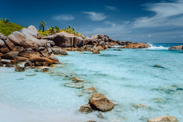 Low tide on paradise beach Anse Cocos on La Digue, Seychelles. Vacation background