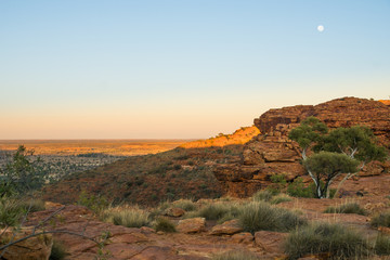 moon rising over sandstone formation in the outback of australia, sunrise