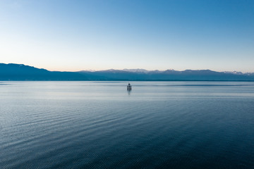 Calm panoramic view of Lake Constance with the Austrian Alps in the background, Bavaria, Germany