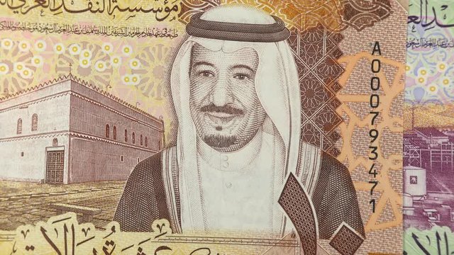 Saudi Arabia riyal banknotes close up rotating. Saudi Arabian money, currency. 4K stock video footage