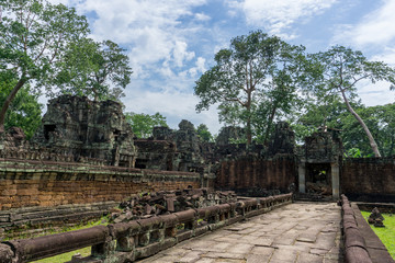 Fototapeta na wymiar Stone walkway inside a temple in the Angkor UNESCO World Heritage Site
