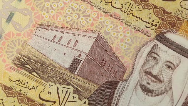Saudi Arabia riyal banknotes rotating. Saudi Arabian money, currency. 4K stock video footage