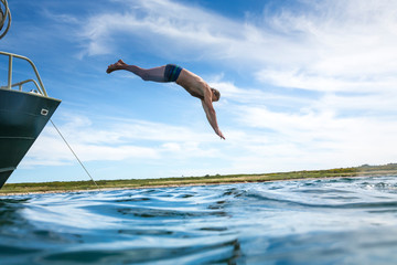 Croatia, istria, Pula, senior jumping into the sea